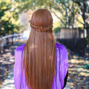 back view of woman with long red hair and back braid