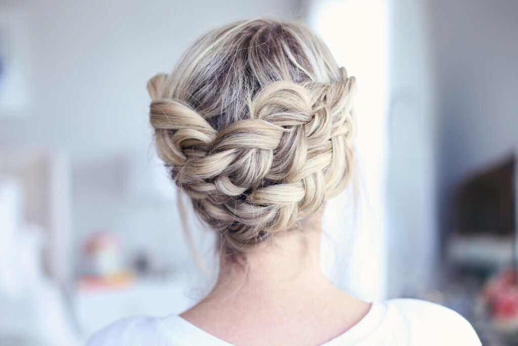 Close up view of young women standing in her room modeling "Crown Braid" hairstyle