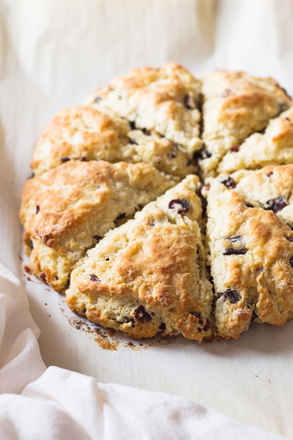 Cherry and Chocolate Scones cut into 8 slices, placed on a white background