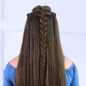 Back view of girl with blue shirt standing indoors modeling the "Dutch Lace Braid Combo" hairstyle