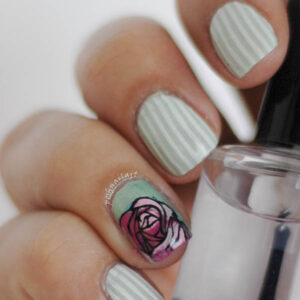 mint and white striped mani with rose accent