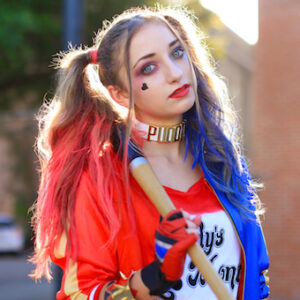 Girl standing outside posing and wearing 'Harley' Halloween costume.