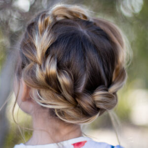 Close up back view of young girl outside modeling "Pull-Thru Crown Braid" hairstyle