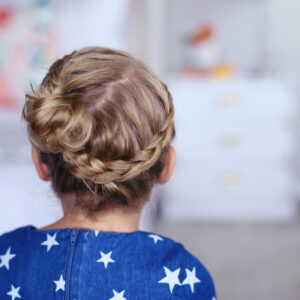 Close up back view of little girl modeling "Toddler Crown Braid" hairstyle