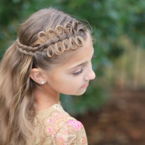 Young girl outside modeling Prim Bow Braid Tieback | Catching Fire | The Hunger Games