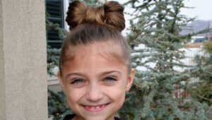 Portrait of young girl modeling the Lady Gaga Bow Hairstyle