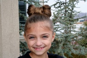 Portrait of young girl modeling the Lady Gaga Bow Hairstyle