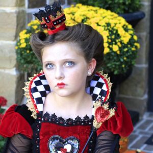 young girl dressed up as the Queen of Hearts |Halloween Hairstyle