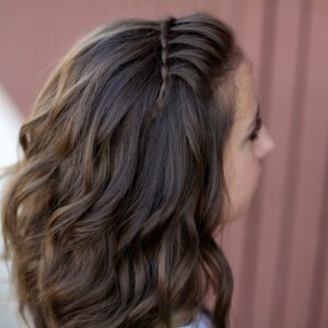 Young girl outside modeling DIY Faux Waterfall Headband