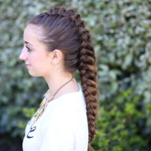 Young girl standing outside modeling Dragon Braid | Hairstyles for Girls