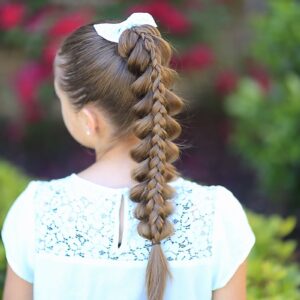 Young girl outside modeling Stacked Pull-Through Braid