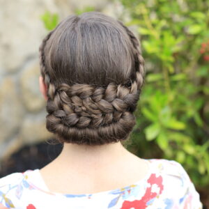 Young girl outside modeling Lace-Rolled Updo Hairstyle (back)