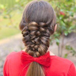 Young girl wearing a red shirt modeling Banded Puff Braid