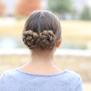 Young girl outside modeling Prim's Braided Updo | Hunger Games Hairstyles