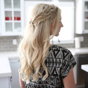 Side view of a blonde woman standing her kitchen modeling "Half Up Side Braid" hairstyle