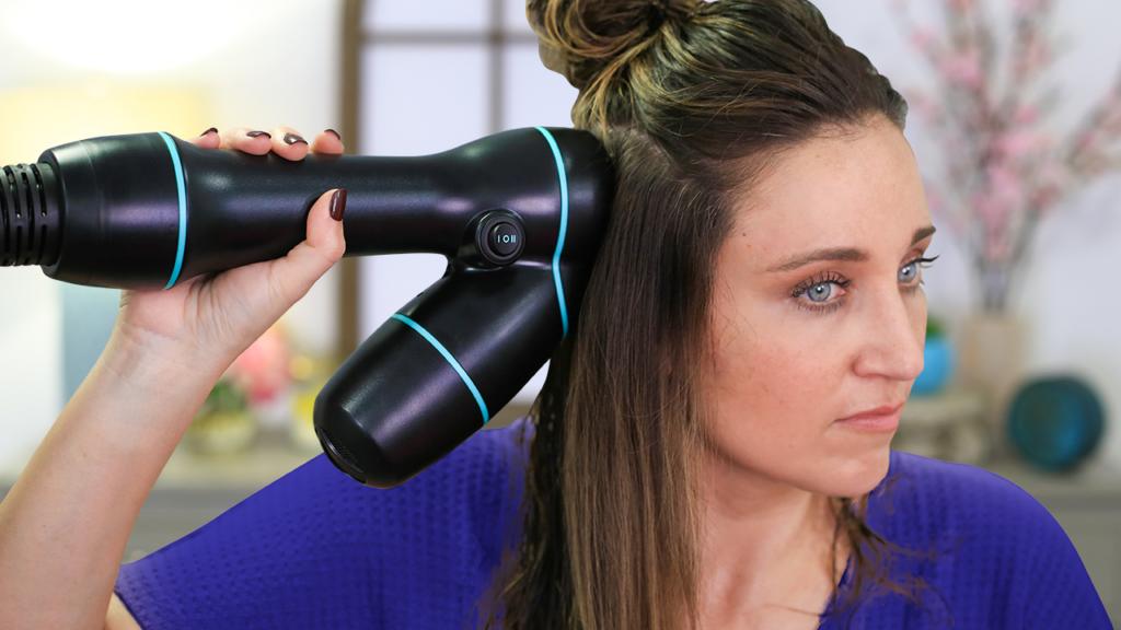 Woman using hair product, "RevAir" to style her hair