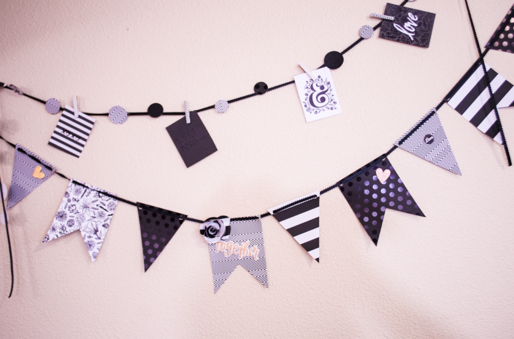 Cute black and white paper banner hanging on a white wall